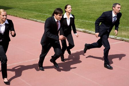 Image of employees running on sport track の写真素材