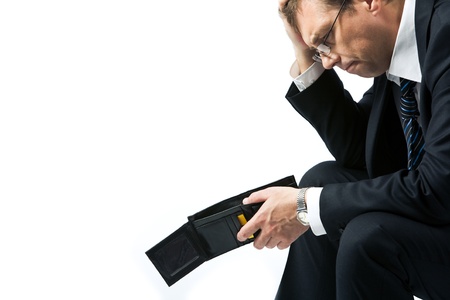 Image of sad businessman holding empty wallet and grieving の写真素材