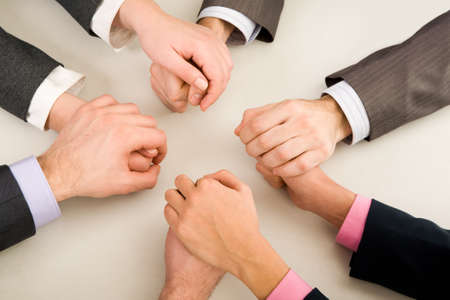 Image of business partners hands holding each otherの写真素材