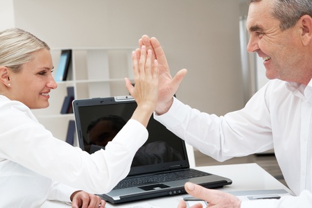 Image of business partners with their palms opposite each other symbolizing support