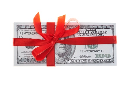 pack of dollars decorated with red ribbon over white background