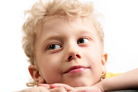 Portrait of face and hand of boy over white backgroundの写真素材