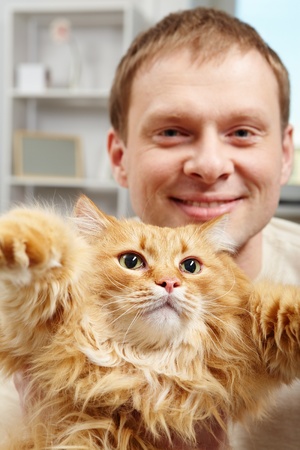 Portrait of a man holding a big catの写真素材