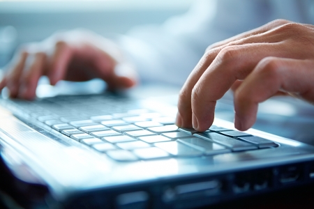 Close-up of typing male hands の写真素材