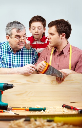 Family of men working with diy toolsの写真素材