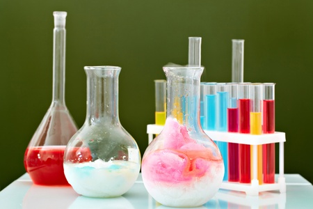 Image of glass bottles and flasks in laboratory