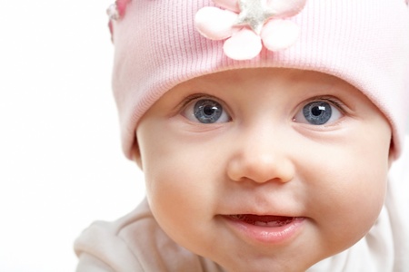 Face of adorable baby in hat looking at cameraの写真素材