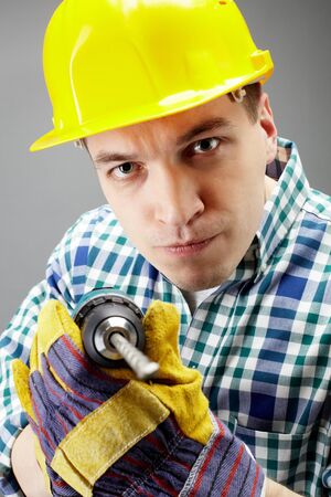 Portrait of architect working with electric drill
