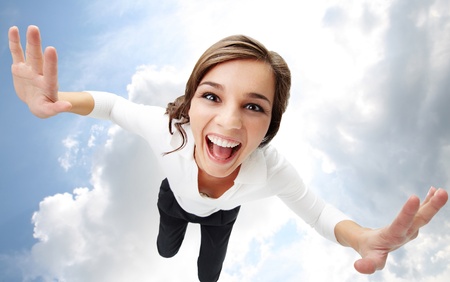 High angle view of a girl screaming with clouds on backgroundの写真素材