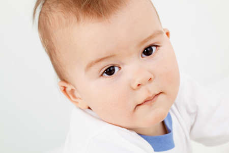 Portrait of calm child over white background