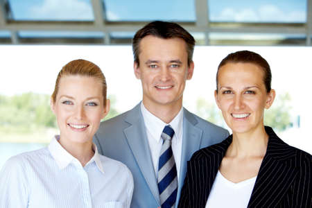 Group of confident business partners looking at camera outsideの写真素材