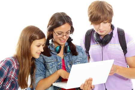 Three teenagers studying with computer