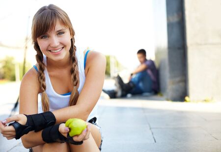 Cute teenage girl looking at camera in park