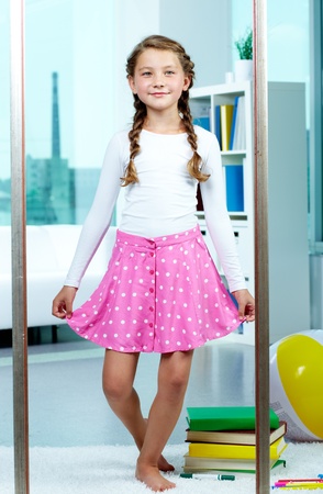 Portrait of young smiling child posing in front of camera  の写真素材
