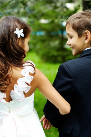 Rear view of children bride and groom on wedding の写真素材