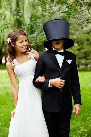 Portrait of funny children bride and groom on wedding の写真素材