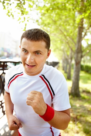 Image of young sportsman running outdoorの写真素材
