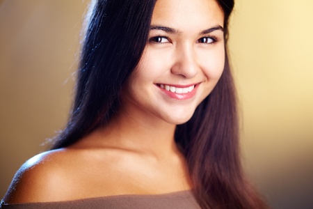 Image of young happy woman looking at camera with smileの写真素材
