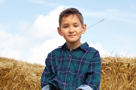 Happy lad looking at camera in countryside