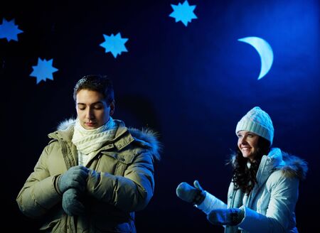Portrait of attractive guy waiting for his girlfriend on dateの写真素材