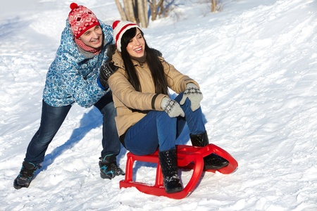 Portrait of happy couple in warm clothes spending time outdoor in winter の写真素材