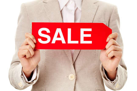 Close-up of female holding sale tag in isolationの写真素材