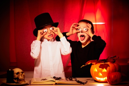 
two eerie boys frightening people on Halloween