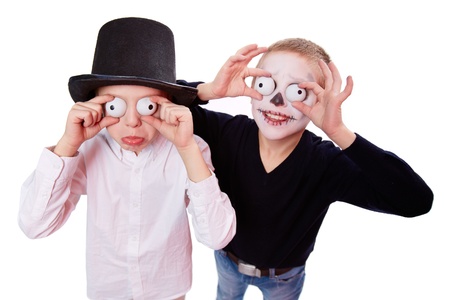 Photo of two eerie boys frightening people on Halloweenの写真素材