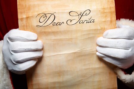 Close-up of Christmas letter in Santa Claus hands