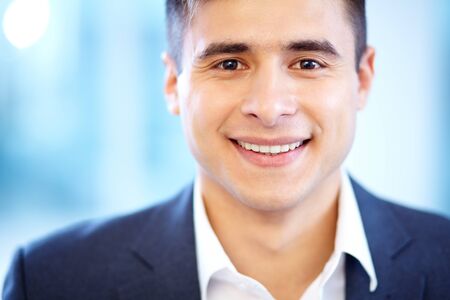 Face of cheerful businessman looking at camera with smileの写真素材
