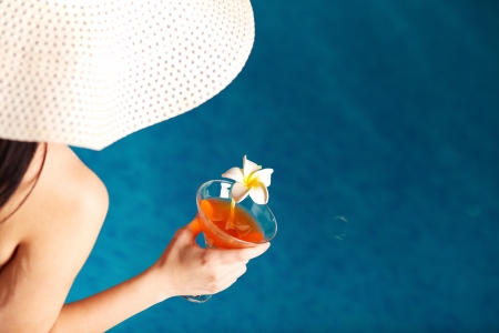 Close-up of cocktail in female hand during toast の写真素材