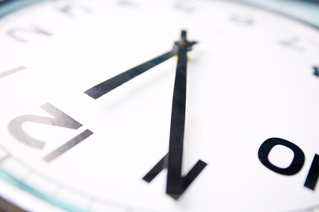 Close-up image of a clock showing five minutes to twelveの写真素材