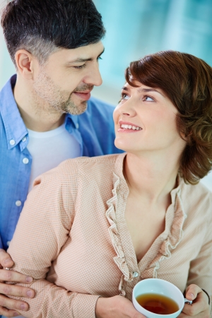 Portrait of happy middle aged couple looking at one anotherの写真素材