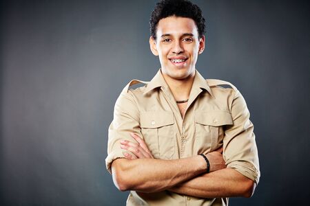 Portrait of handsome guy in shirt looking at cameraの写真素材