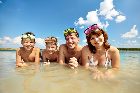  happy family looking at camera during summer vacationの写真素材