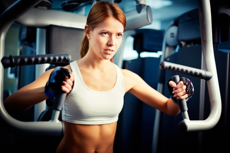 Portrait of young female training in gymの写真素材