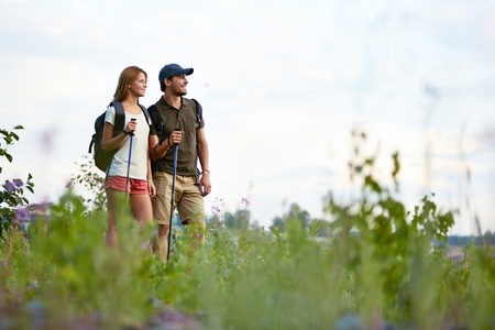 Portrait of two trippers standing in the countryside at summerの写真素材