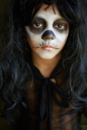 Portrait of spooky girl in Halloween attire looking at cameraの写真素材