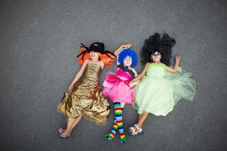 Portrait of three happy girls in Halloween attireの写真素材