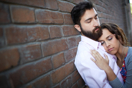 Portrait of affectionate female leaning onto her sweetheartの写真素材
