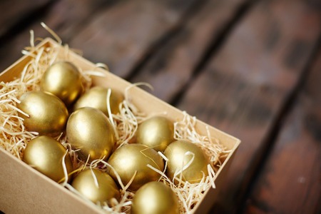 Golden Easter eggs in boxの写真素材