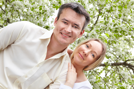 Portrait of happy woman and her husband outsideの写真素材