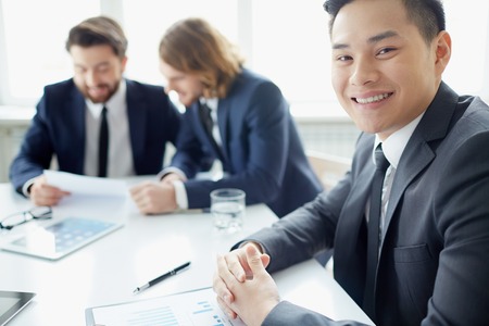 Portrait of a businessman in board room looking at camera 