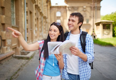 Couple of travelers with map sightseeing in ancient townの写真素材
