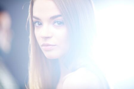 Portrait of pretty young girl looking at cameraの写真素材