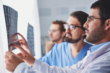 Medical team examining x-ray images