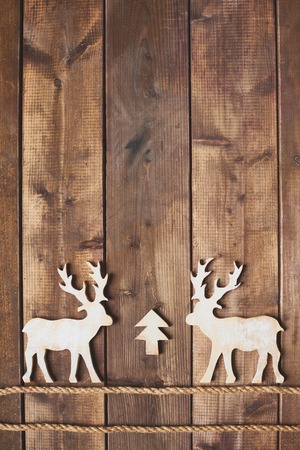 White wooden deers on two ropesの写真素材