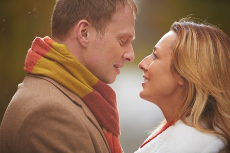 Faces of romantic couple looking at one another