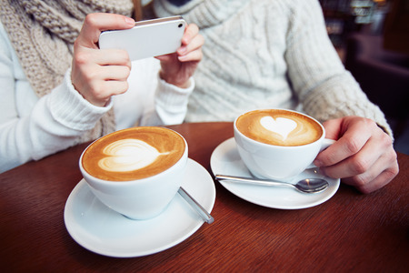 Close-up of two cups with latteの写真素材