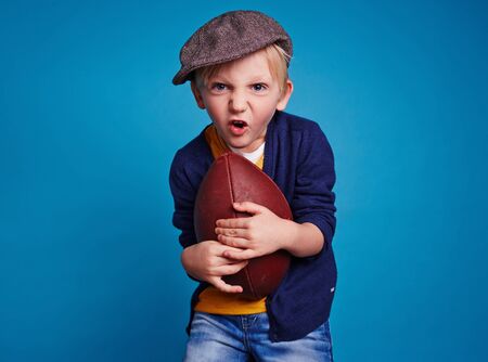 Little boy with rugby ballの写真素材